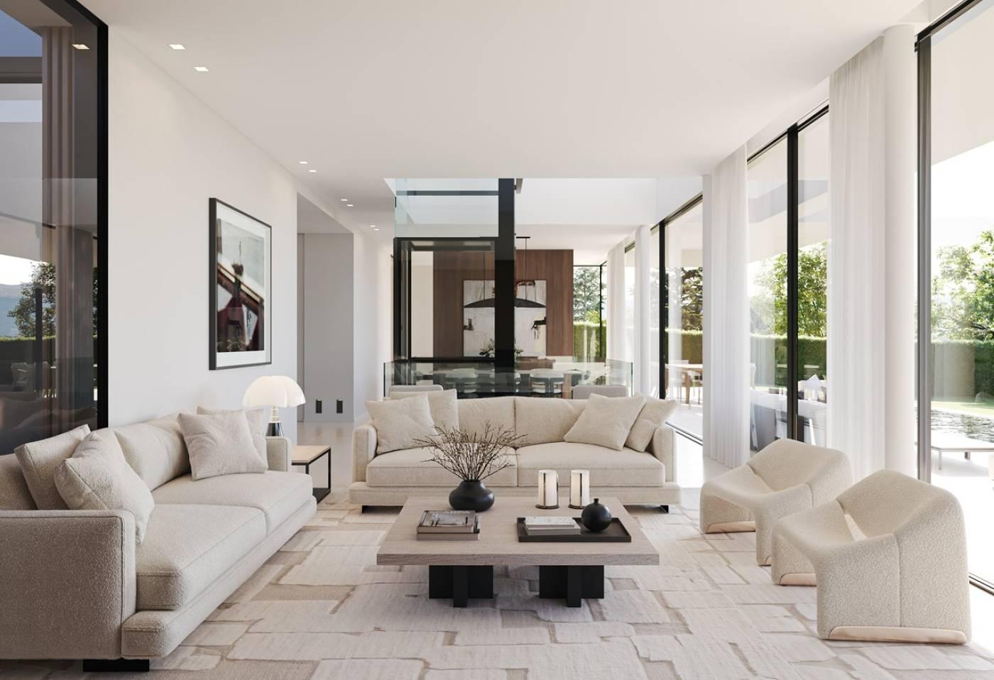 A bright, guest-ready vacation rental living room with cream sofas and floor-to-ceiling windows